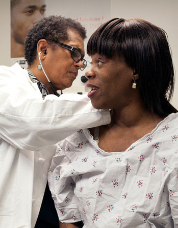 Photo of an African American woman with a health care professional