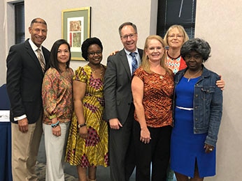 HRSA meeting with community health leaders in South Carolina in July 2019 to discuss the Ending the HIV Epidemic: A Plan for America initiative and the progress made toward ending the HIV epidemic in the state. Left to right: Dr. Eric Schlueter, Chief Medical Officer, Eau Claire Cooperative Health Center (ECCHC), Peatra Cruz, Chief Organizational Development and Communications, ECCHC, Mulamba Lunda, Regional Director, Ryan White HIV/AIDS Program & Prevention Programs, ECCHC, Jim Macrae, Associate Administrator, Bureau of Primary Health Care, HRSA, Lisa Mariani, Regional Administrator, Office of Regional Operations – Region 4, HRSA, Dr. Laura Cheever, Associate Administrator, HIV/AIDS Bureau, HRSA, Lathran Woodard, CEO, South Carolina Primary Care Association.