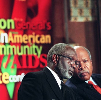 Surgeon General David Satcher, left, speaks with Louis Sullivan, president, Morehouse School of Medicine, at a conference to mobilize African-Americans around the rising threat of AIDS in their communities.